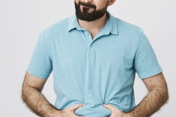 A man is holding holding his belly